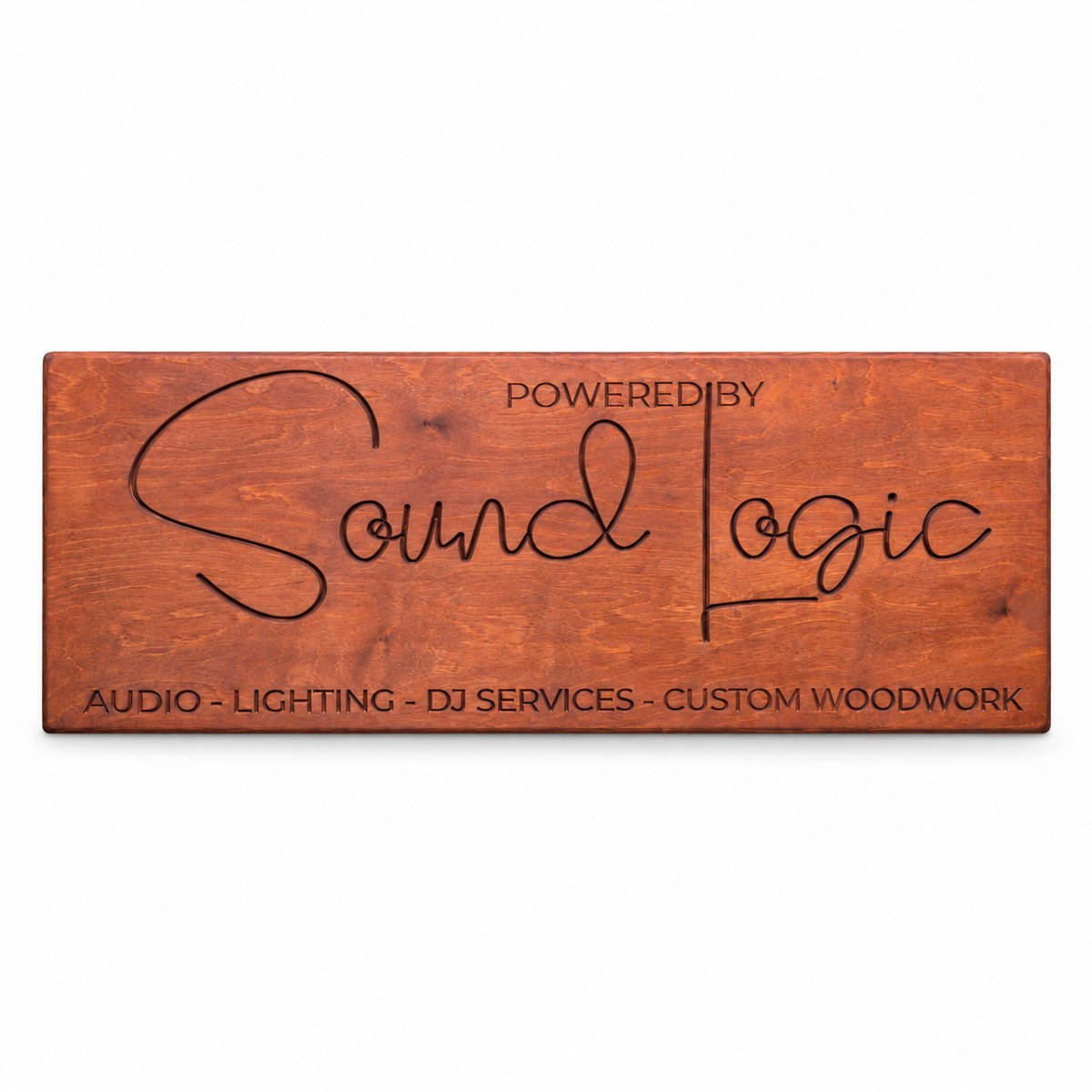 Carved Sound Logic sign in warm reddish wood on a white background