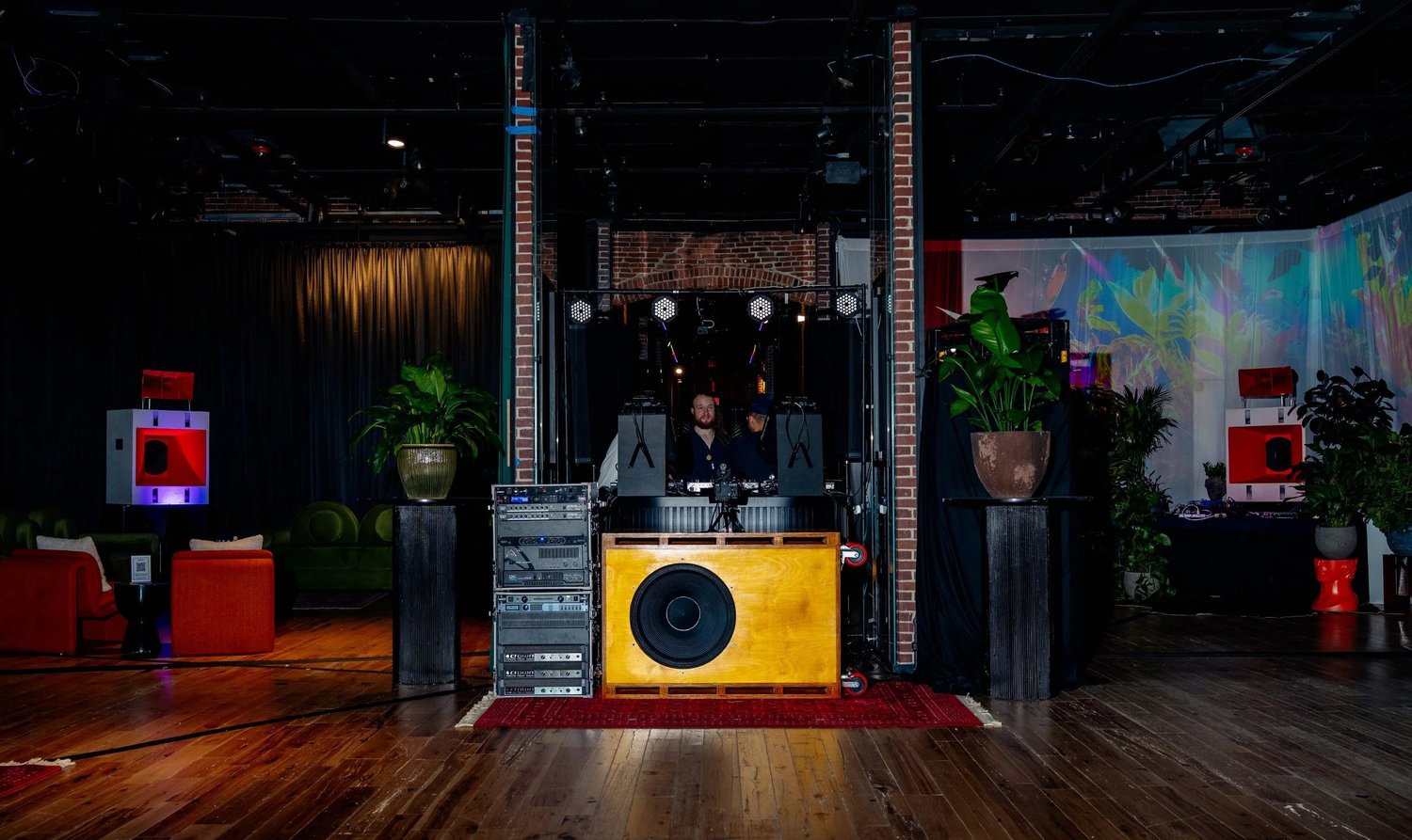 Wood-finished Sound Logic speaker cabinet in a complete event system